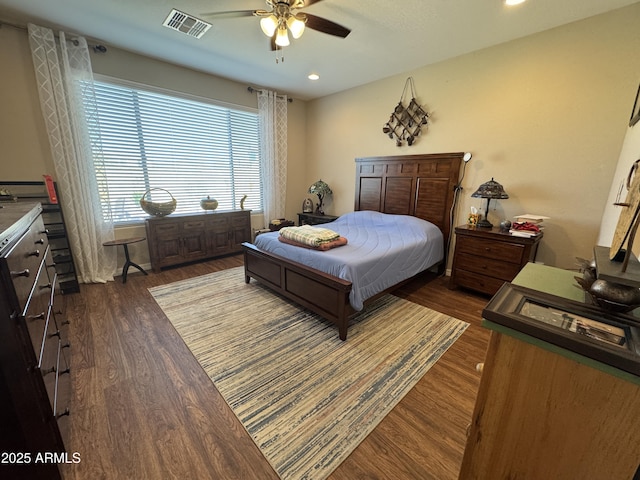 bedroom with dark wood-type flooring and ceiling fan