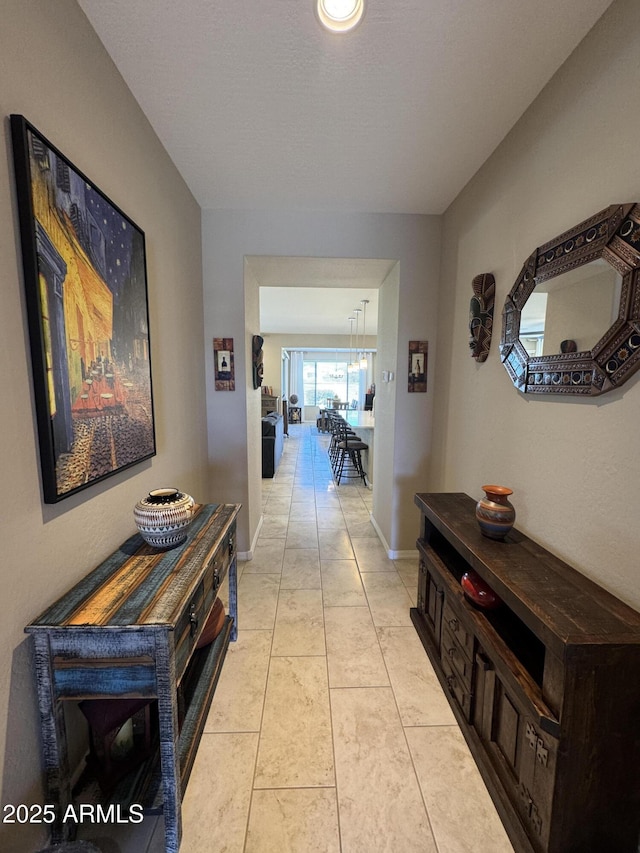 hallway with light tile patterned flooring