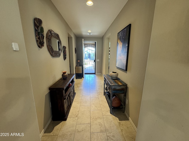 corridor with light tile patterned floors