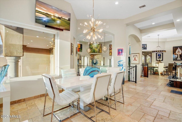 dining space featuring recessed lighting, visible vents, baseboards, stone tile flooring, and an inviting chandelier