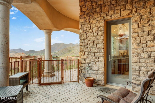 balcony featuring a patio area and a mountain view