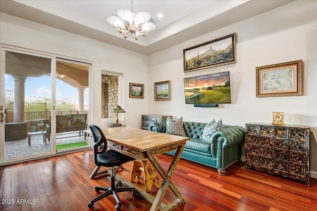 office with recessed lighting, wood-type flooring, a raised ceiling, and a notable chandelier