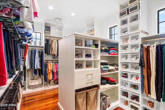 spacious closet with visible vents and wood finished floors