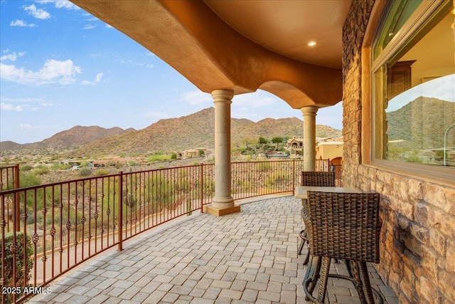 view of patio / terrace with a mountain view