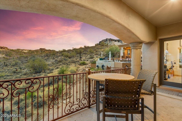 view of balcony at dusk