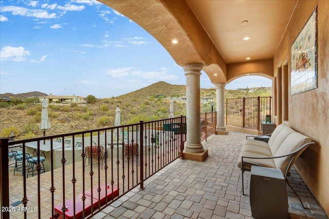 balcony featuring a mountain view