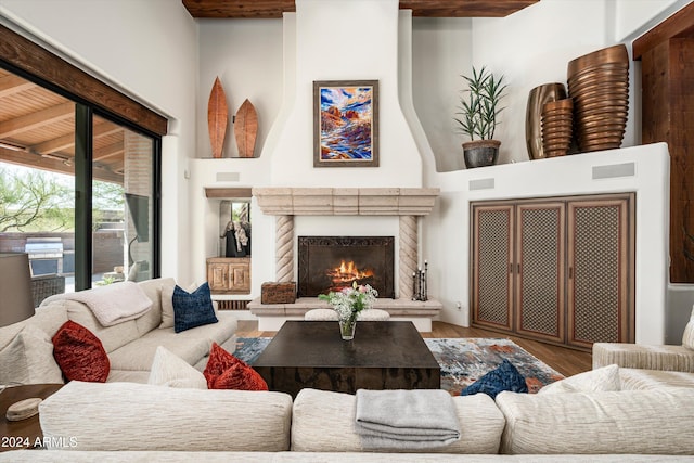 living room featuring hardwood / wood-style flooring and beam ceiling