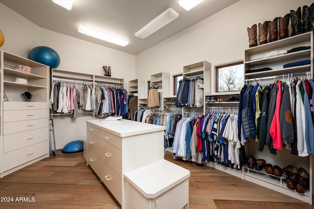 walk in closet with light wood-type flooring