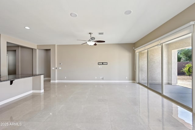 unfurnished room with baseboards, visible vents, recessed lighting, ceiling fan, and marble finish floor