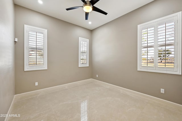 spare room with recessed lighting, a ceiling fan, and baseboards