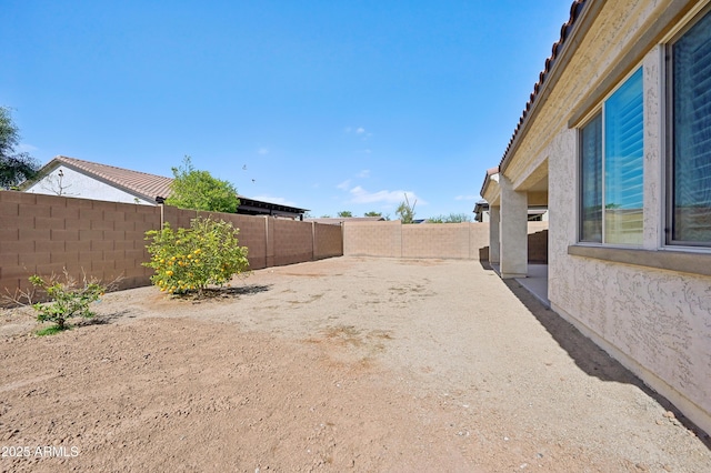 view of yard featuring a patio and a fenced backyard