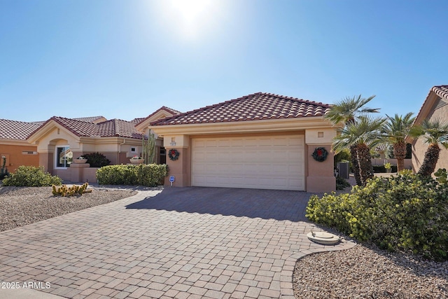 mediterranean / spanish-style home featuring a garage