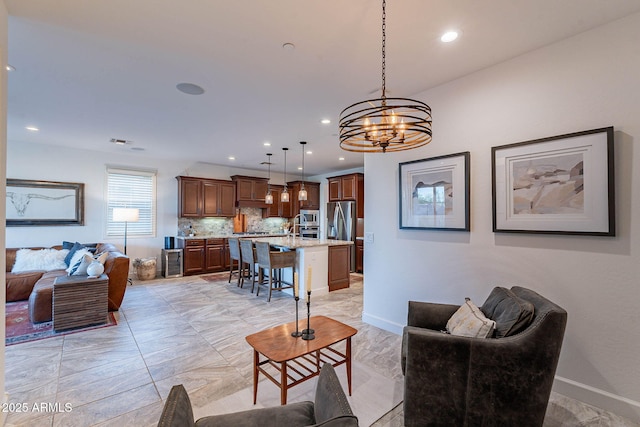 13719 W Amberwing St, Peoria, AZ 85383 - living area with a chandelier, recessed lighting, and baseboards
