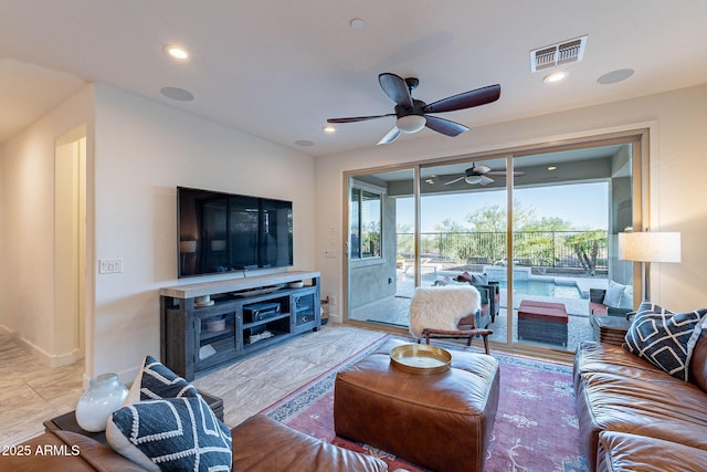 13719 W Amberwing St, Peoria, AZ 85383 - living area featuring a ceiling fan and recessed lighting