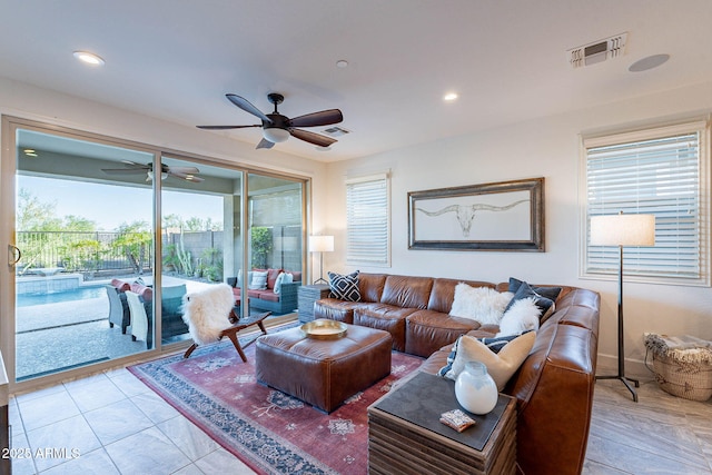 13719 W Amberwing St, Peoria, AZ 85383 - living room with ceiling fan and recessed lighting