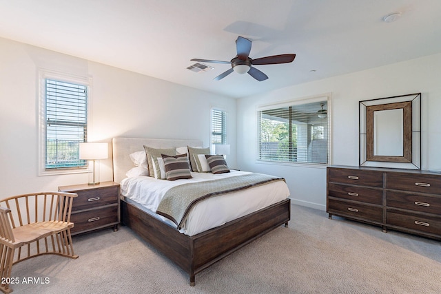 13719 W Amberwing St, Peoria, AZ 85383 - bedroom with light colored carpet, baseboards, and ceiling fan