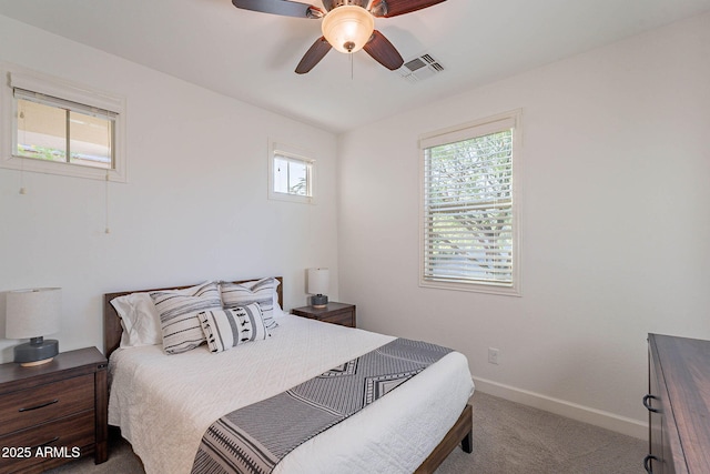 13719 W Amberwing St, Peoria, AZ 85383 - carpeted bedroom featuring baseboards and a ceiling fan
