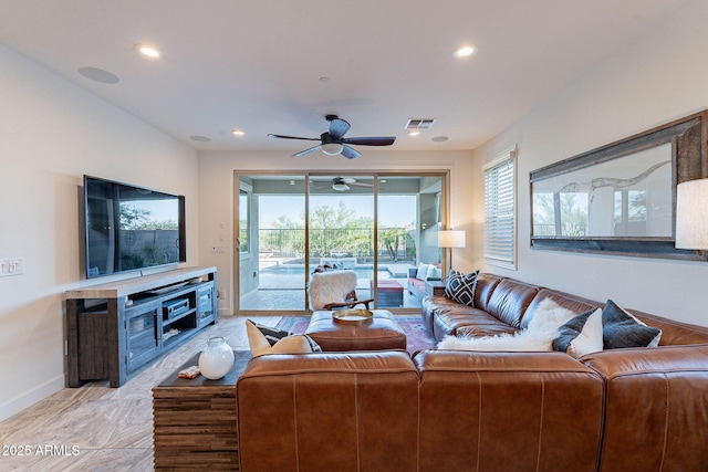 13719 W Amberwing St, Peoria, AZ 85383 - living room with ceiling fan, healthy amount of natural light, recessed lighting, and baseboards