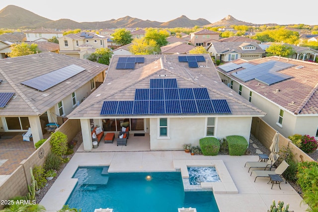 13719 W Amberwing St, Peoria, AZ 85383 - rear view of house featuring a fenced backyard, an outdoor living space, a mountain view, and a residential view
