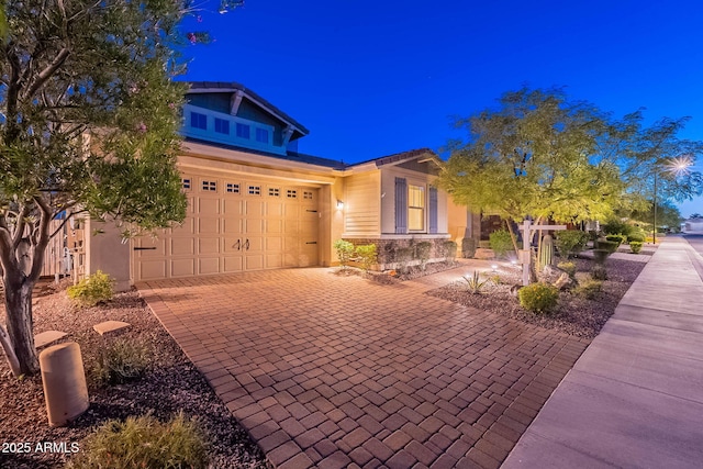 13719 W Amberwing St, Peoria, AZ 85383 - craftsman inspired home featuring decorative driveway and stone siding