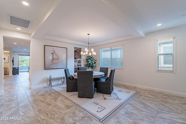 13719 W Amberwing St, Peoria, AZ 85383 - dining room featuring a raised ceiling, a chandelier, baseboards, light marble finish flooring, and recessed lighting