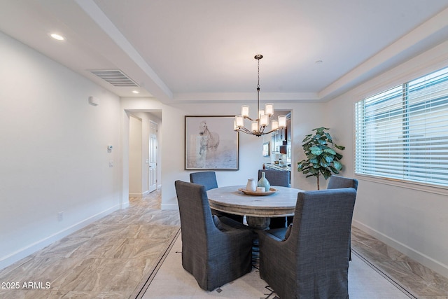 13719 W Amberwing St, Peoria, AZ 85383 - dining room with a chandelier, a tray ceiling, light marble finish flooring, baseboards, and recessed lighting