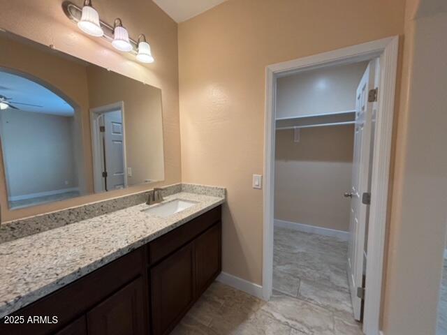 bathroom with vanity and ceiling fan