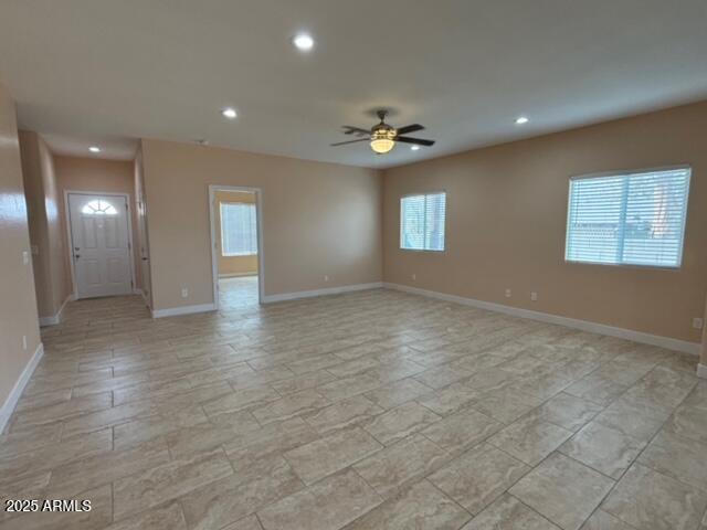 interior space featuring ceiling fan