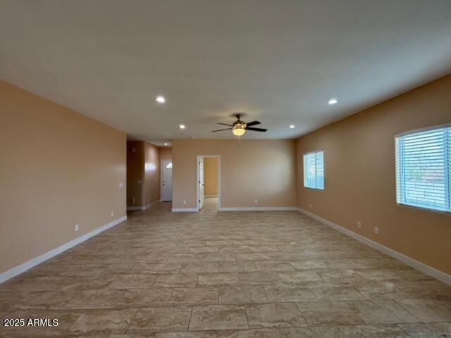 spare room with ceiling fan