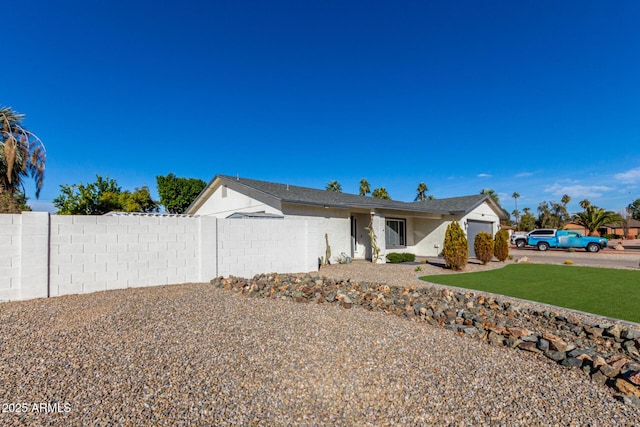 ranch-style house featuring a garage