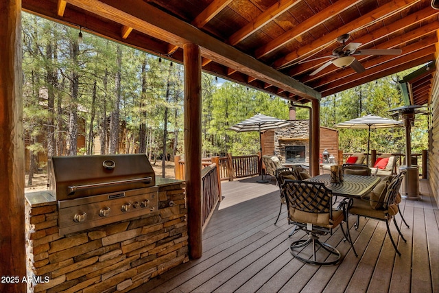 2640 W Maple Ln, Show Low, AZ 85901 - wooden terrace featuring outdoor dining area and view of scattered trees