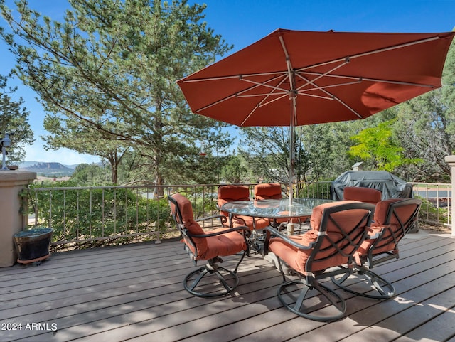 wooden terrace with a mountain view and grilling area