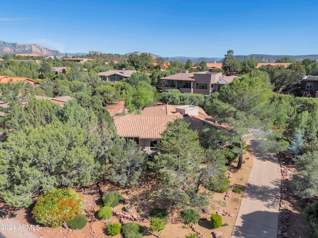 birds eye view of property with a mountain view