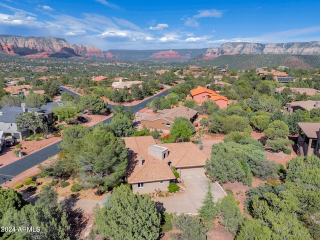 birds eye view of property featuring a mountain view