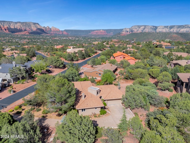 birds eye view of property featuring a mountain view