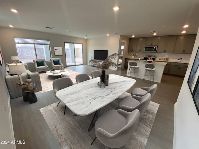 dining space featuring hardwood / wood-style flooring