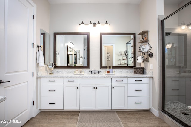 3118 E Gary Way, Phoenix, AZ 85042 - full bathroom with a stall shower, vanity, and wood finished floors