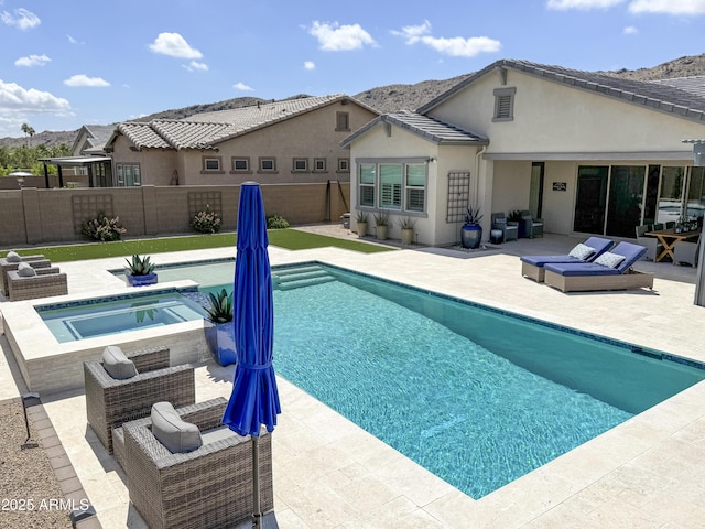 3118 E Gary Way, Phoenix, AZ 85042 - view of swimming pool featuring an in-ground hot tub, a patio area, and a mountain view