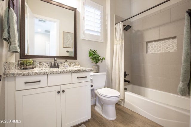3118 E Gary Way, Phoenix, AZ 85042 - bathroom featuring toilet, shower / tub combo, vanity, and wood finished floors