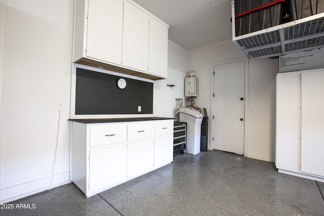 3118 E Gary Way, Phoenix, AZ 85042 - garage featuring water heater and baseboards