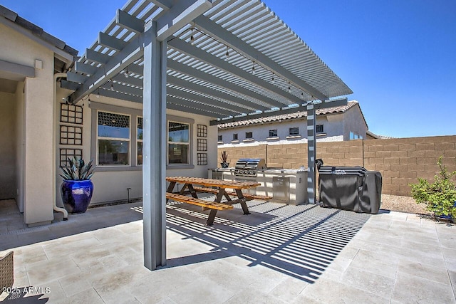 3118 E Gary Way, Phoenix, AZ 85042 - view of patio / terrace featuring a pergola and exterior kitchen
