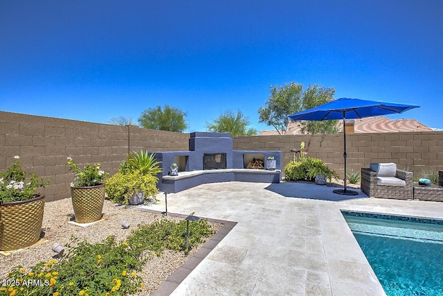 3118 E Gary Way, Phoenix, AZ 85042 - view of pool with a patio area, a fenced backyard, and exterior fireplace