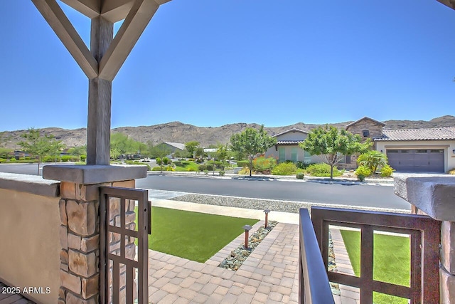 3118 E Gary Way, Phoenix, AZ 85042 - view of patio / terrace featuring a mountain view and a garage