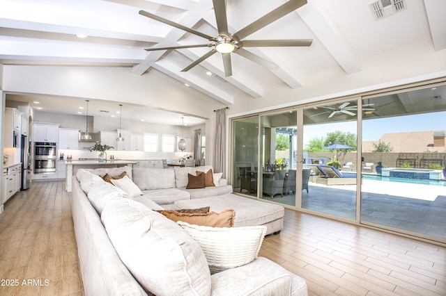 3118 E Gary Way, Phoenix, AZ 85042 - living room with a ceiling fan, light wood-style floors, and recessed lighting
