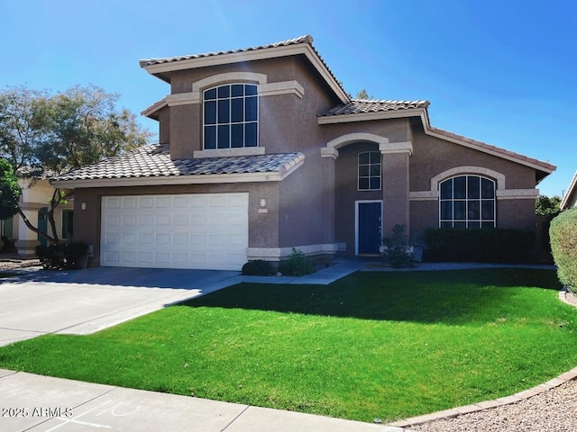 mediterranean / spanish home featuring stucco siding, concrete driveway, an attached garage, a front yard, and a tiled roof