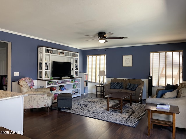 living room featuring crown molding, a ceiling fan, and dark wood-style flooring