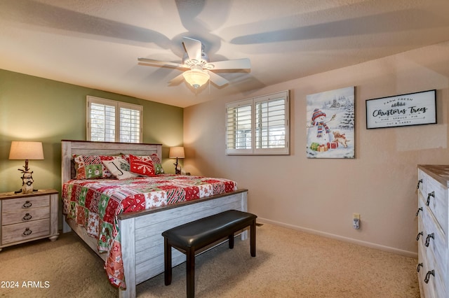 bedroom featuring ceiling fan and light carpet