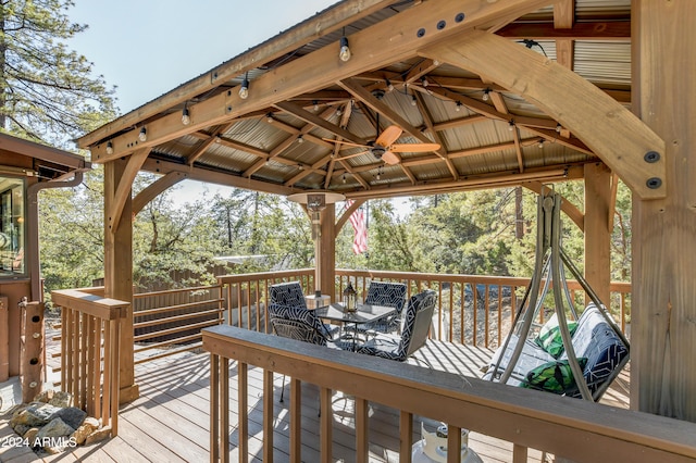 deck featuring a gazebo and ceiling fan