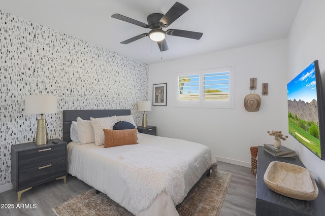 bedroom with ceiling fan and dark hardwood / wood-style flooring