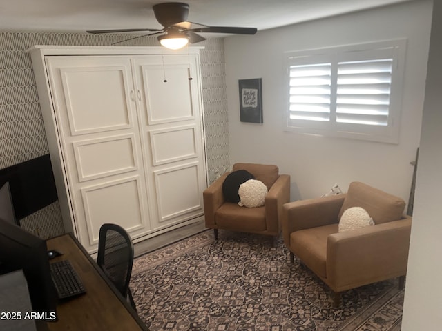 living area with ceiling fan